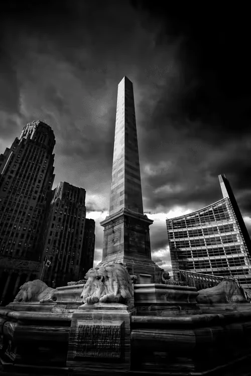 Bright Darkness: black-and-white monument beneath a dramatic sky