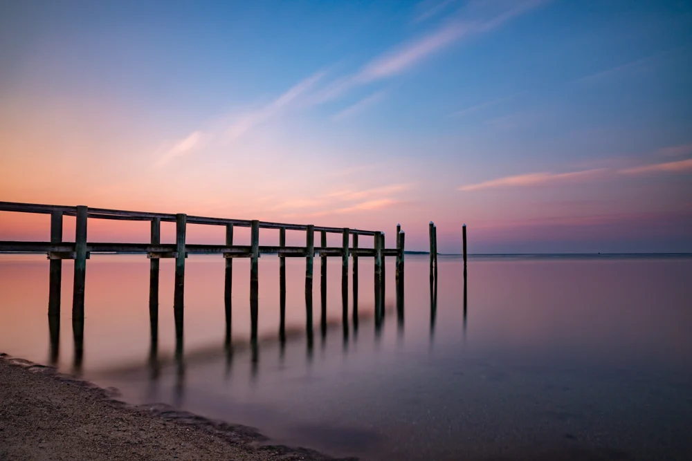 Cape Cod Sunrise: a wooden pier beneath a pastel sky