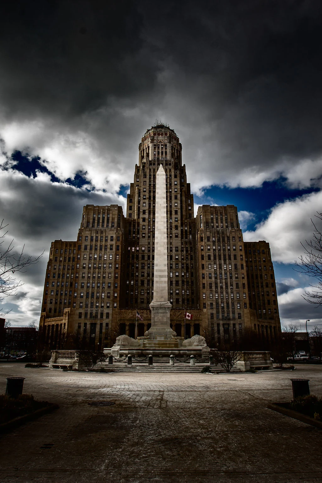 Buffalo City Hall and its monument beneath dramatic dark clouds